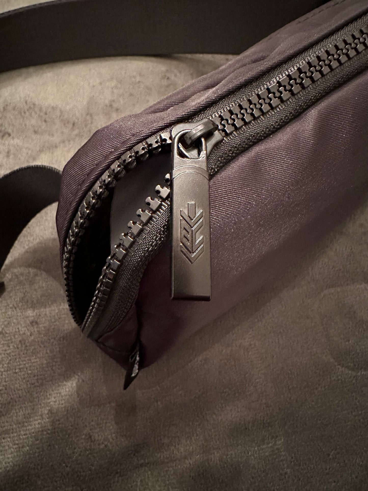 2. BaseCamp Field Tested Crossbody Bag with Spearhead Logo.